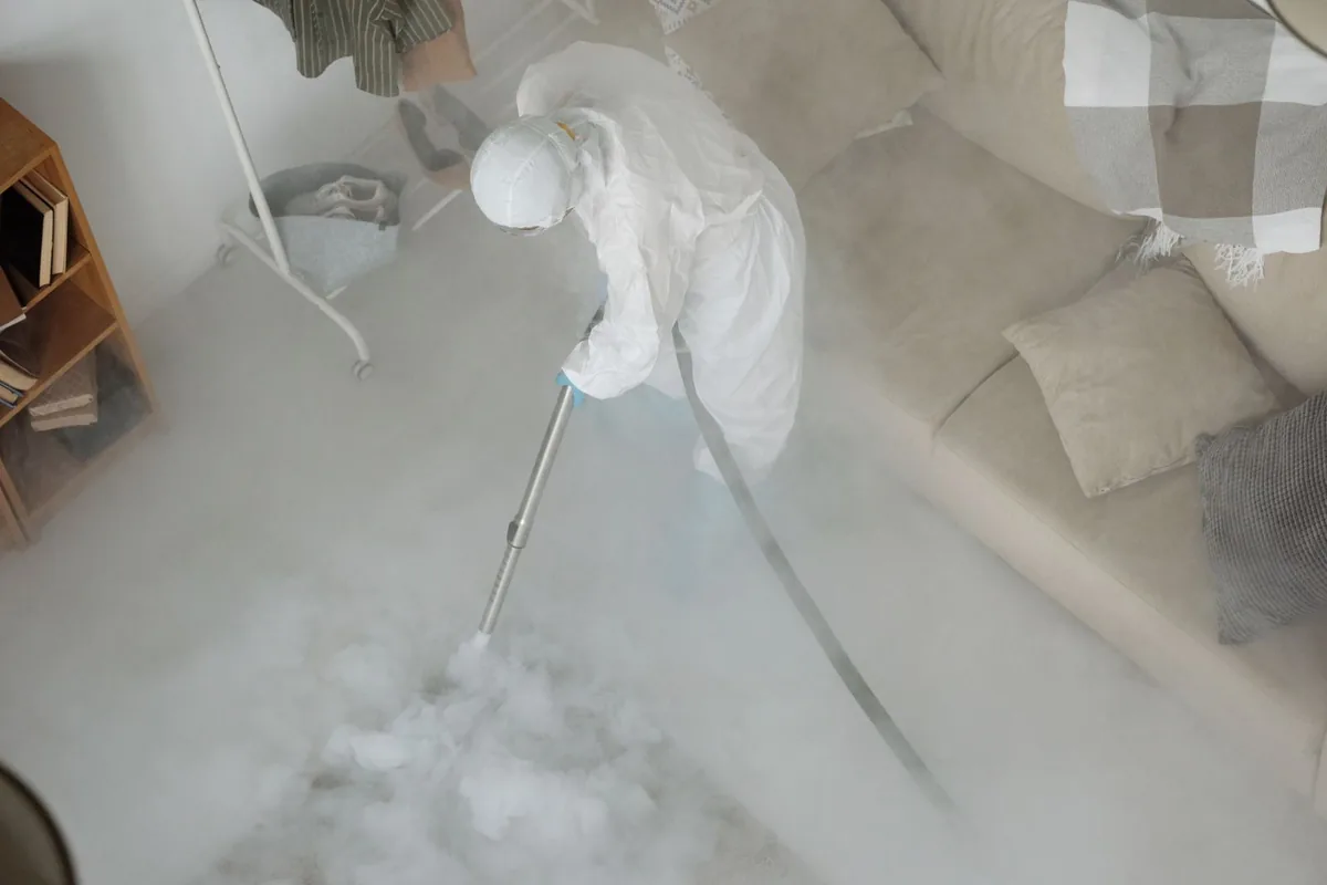 Biohazard cleanup technician in protective equipment, North Muskegon, MI